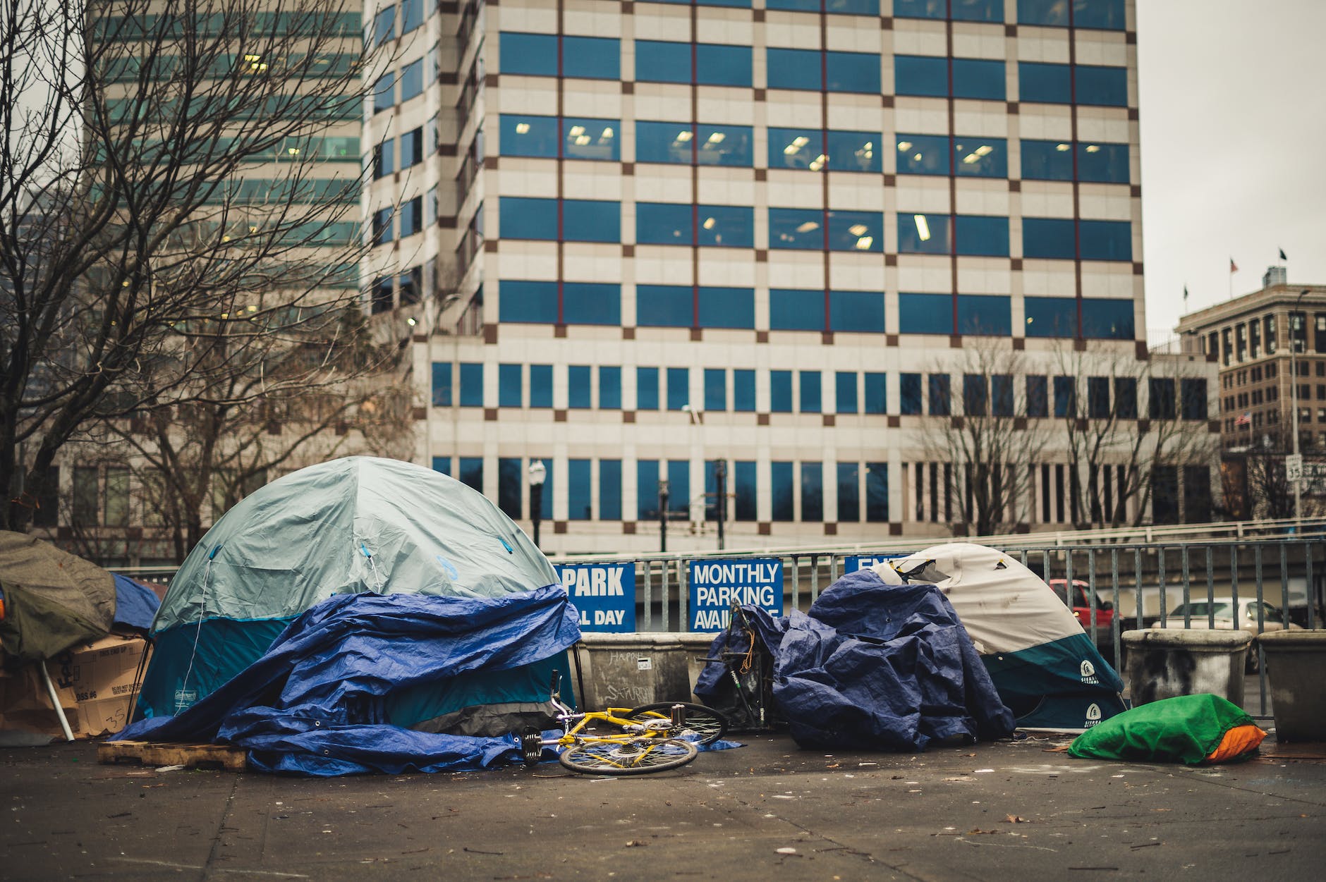tents and bicycle on city street